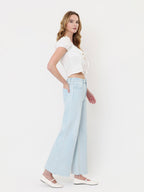 HIGH RISE CLEAN CUT RAW HEM WIDE FLARE JEANS T7401
