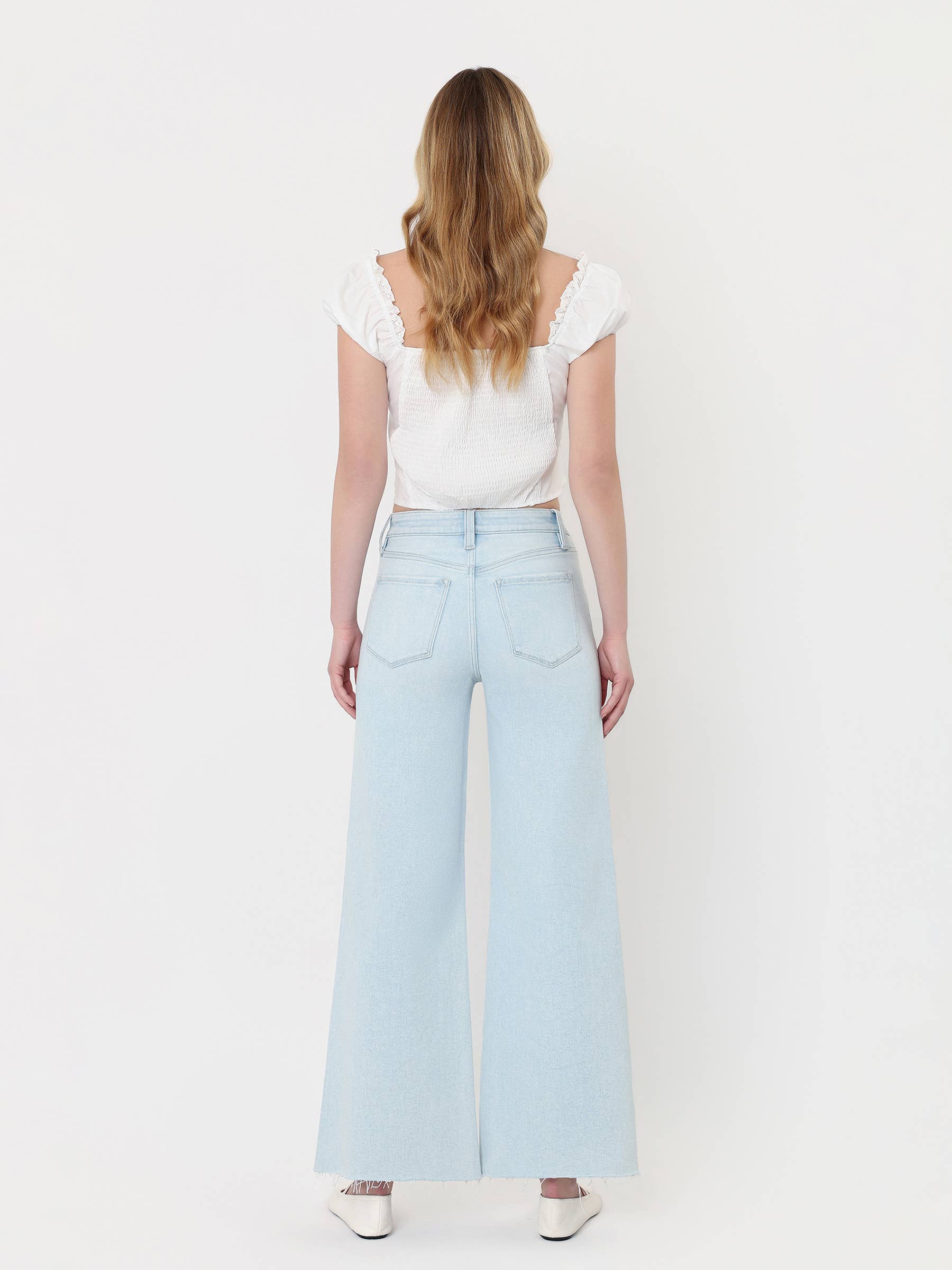 HIGH RISE CLEAN CUT RAW HEM WIDE FLARE JEANS T7401